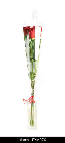 Tre rose rosse in un vaso Foto Stock