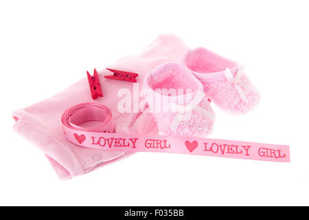 Neonato ragazza con i vestiti e il nastro in rosa Foto Stock