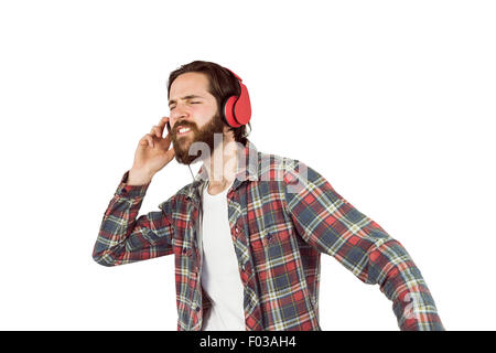 Bello hipster godendo di ascolto di musica Foto Stock