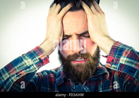 Bello hipster ottenendo un mal di testa Foto Stock