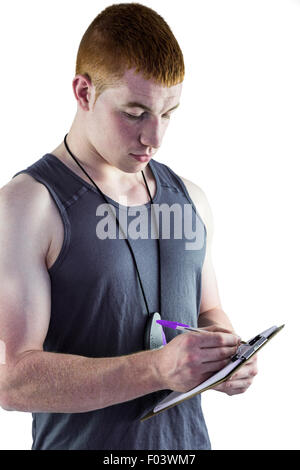 Montare il trainer personale iscritto negli appunti Foto Stock