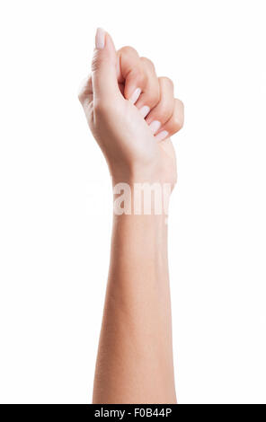 Donna serrata a mano in un pugno con belle unghie curati, sfondo bianco, isolato Foto Stock