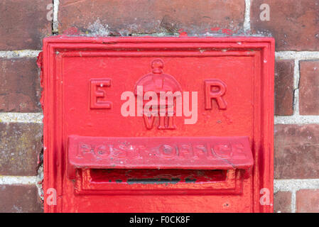 Una parete montata Edward VII post box Foto Stock