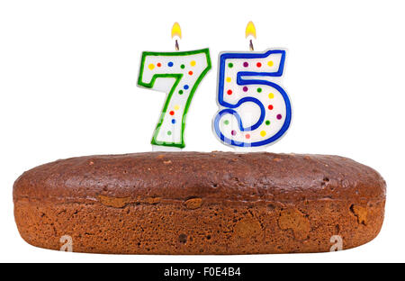 Torta di compleanno con candele numero settantacinque Foto Stock