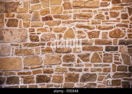 Muro di pietra foto sullo sfondo. Parete rocciosa. Foto Stock