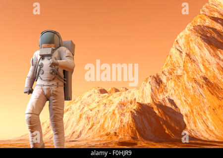 Un astronauta camminando sulla superficie di Marte. 3D'illustrazione. Foto Stock