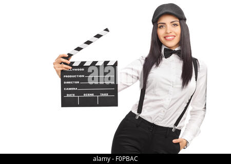 Femmina direttore del filmato in un artistico vestito e tenendo un clapperboard isolati su sfondo bianco Foto Stock