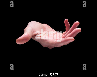 Colpo di aprire e svuotare la mano come se in possesso di un oggetto, su sfondo nero Foto Stock