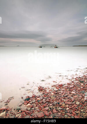 Scale per nulla al tramonto con il Bass Rock a distanza Foto Stock