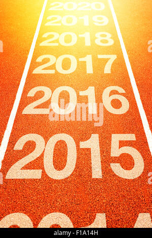 2016, Felice Anno Nuovo, continua anno numeri contano su di atletica leggera traccia in esecuzione. Felice anno nuovo Foto Stock