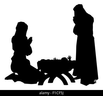 Religiosi tradizionali di Natale cristiano scena della Natività del Bambino Gesù nella mangiatoia con Maria e Giuseppe in silhouette Foto Stock