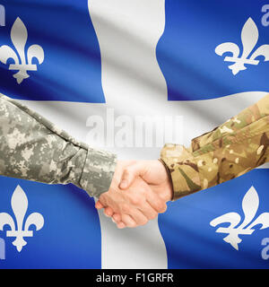 Soldati e handshake provincia canadese bandiera - Québec Foto Stock