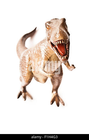Giocattolo replica in plastica di un Tirannosauro Rex isolato Foto Stock