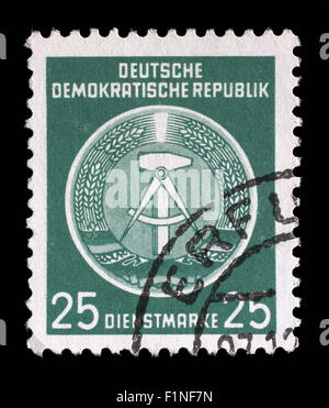 Timbro stampato nella RDT (Repubblica Democratica Tedesca - Germania Est) mostra la memoria DDR stemma nazionale, circa 1952 Foto Stock