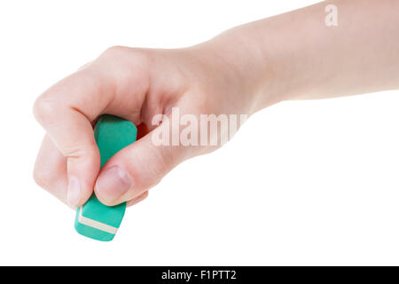 Mano con nuova gomma verde eraser close up isolati su sfondo bianco Foto Stock