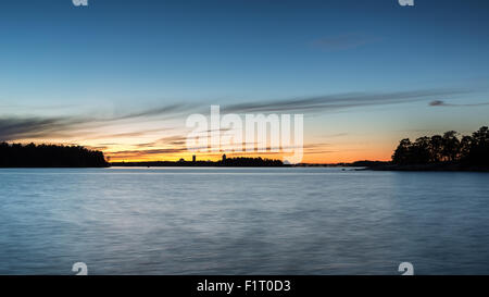 Il tramonto visto da Läntinen Käärmeluoto isola, Helsinki, Finlandia, Europa, UE Foto Stock