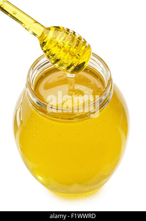 Vetro con miele e bilanciere isolato su uno sfondo bianco. Foto Stock