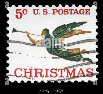 Un saluto Natale timbro stampato negli Stati Uniti mostra angelo con tromba, circa settanta Foto Stock
