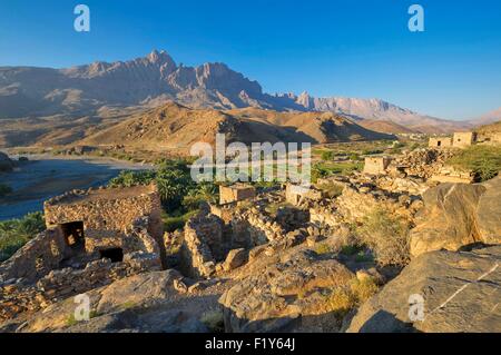 Oman, Djebel Shams, Wadi Ghul, antico borgo e Palm grove Foto Stock