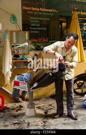 Il Vietnam, Hanoi, haidresser nella città vecchia Foto Stock