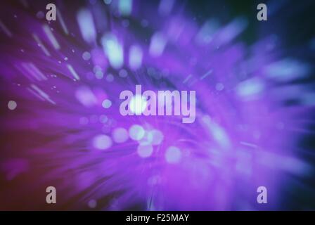 Particelle colorate volare nello spazio della fibra ottica e volteggiare ( abstract blur sullo sfondo ) Foto Stock