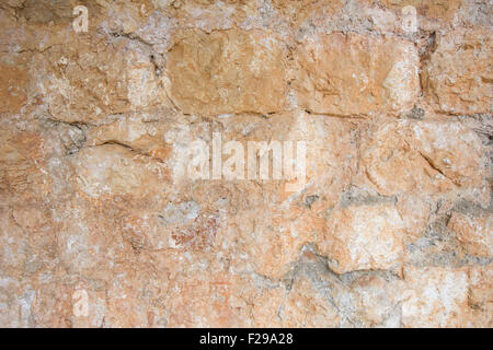 Vecchio, invecchiato e ruvida arancione di parete di mattoni sfondo texture. Foto Stock