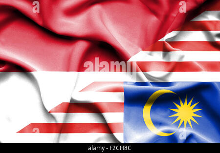 Sventola bandiera della Malaysia e Indonesia Foto Stock