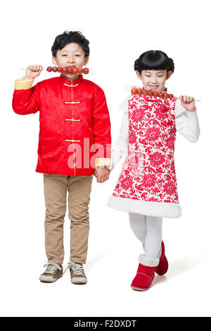 Carino bambini mangiare haws candita Foto Stock