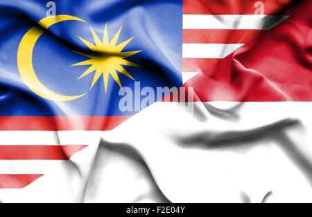 Sventola bandiera dell' Indonesia e della Malaysia Foto Stock