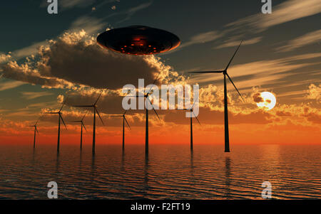 Un UFO volare su un oceano Wind Farm. Foto Stock