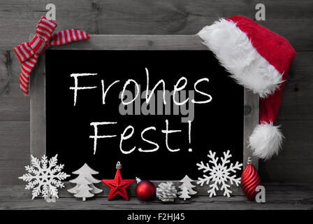 Blackboard Santa Hat Frohes Fest significa Buon Natale Foto Stock