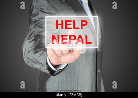 Imprenditore spingendo virtual aiutare il Nepal pulsante su sfondo nero Foto Stock