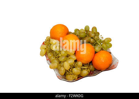 Piatto con uva e mandarini Foto Stock