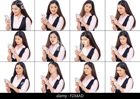 1 indian Business donna confronto telefono mobile multi-tasking Foto Stock