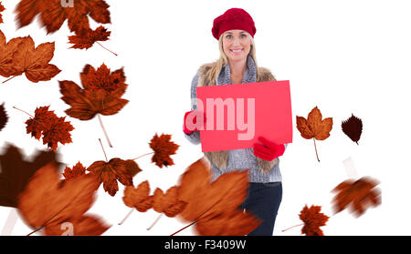 Immagine composita del biondino di abbigliamento invernale azienda segno rosso Foto Stock