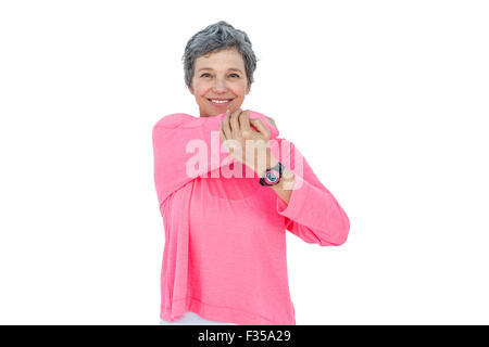 Ritratto di Allegro donna matura stretching Foto Stock