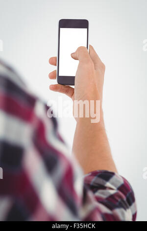 L'uomo utilizza lo smartphone Foto Stock