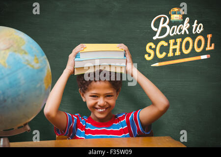 Immagine composita della pupilla carino con i libri Foto Stock