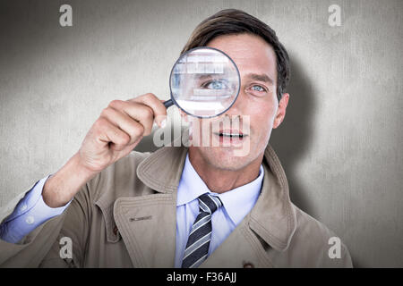 Immagine composita di spy guardando attraverso la lente di ingrandimento Foto Stock