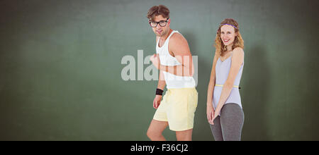 Immagine composita di geeky hipster matura in posa di abbigliamento sportivo Foto Stock