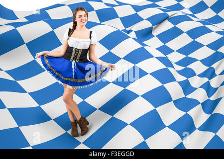 Immagine composita di oktoberfest ragazza espandendo il suo mantello Foto Stock