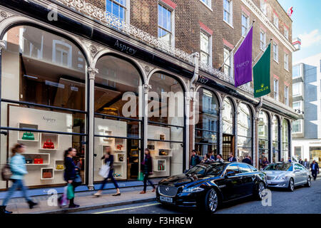 Auto di lusso attendono fuori Asprey Gioielleria, New Bond Street, Londra, Regno Unito Foto Stock