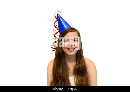 Ragazza che indossa un partito blu con cappello di rosso e oro streamers Foto Stock