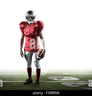 Immagine composita del ritratto di uno sportivo con il football americano Foto Stock