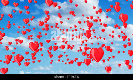 Cuore rosso palloncini sagomati nel cielo blu con nuvole Foto Stock