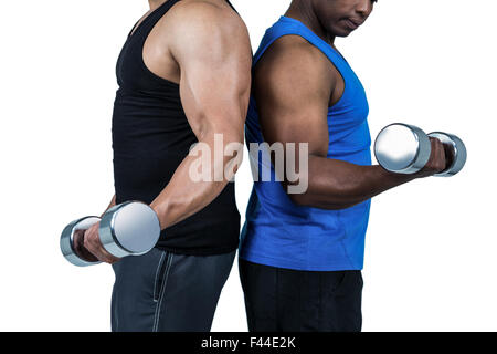 Forte amici in posa con manubri Foto Stock