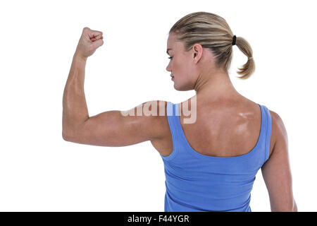 Vista posteriore della donna muscolare dei muscoli di flessione Foto Stock