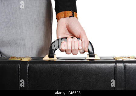 Primo piano della mano e valigetta. Foto Stock