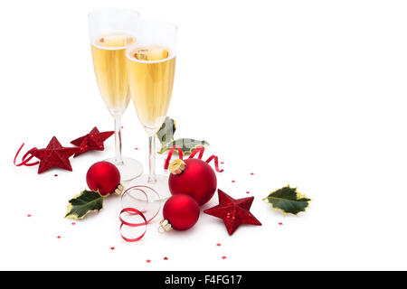 Le palle di Natale, stelle Holly foglie e champagne. Foto Stock