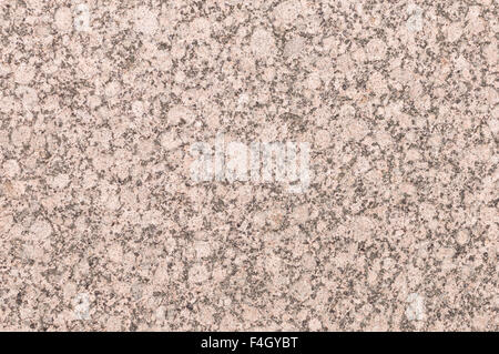 Minerali con sfondo rosso o rosa texture di granito tagliati e ruvida la superficie del rivestimento decorativo stone Foto Stock